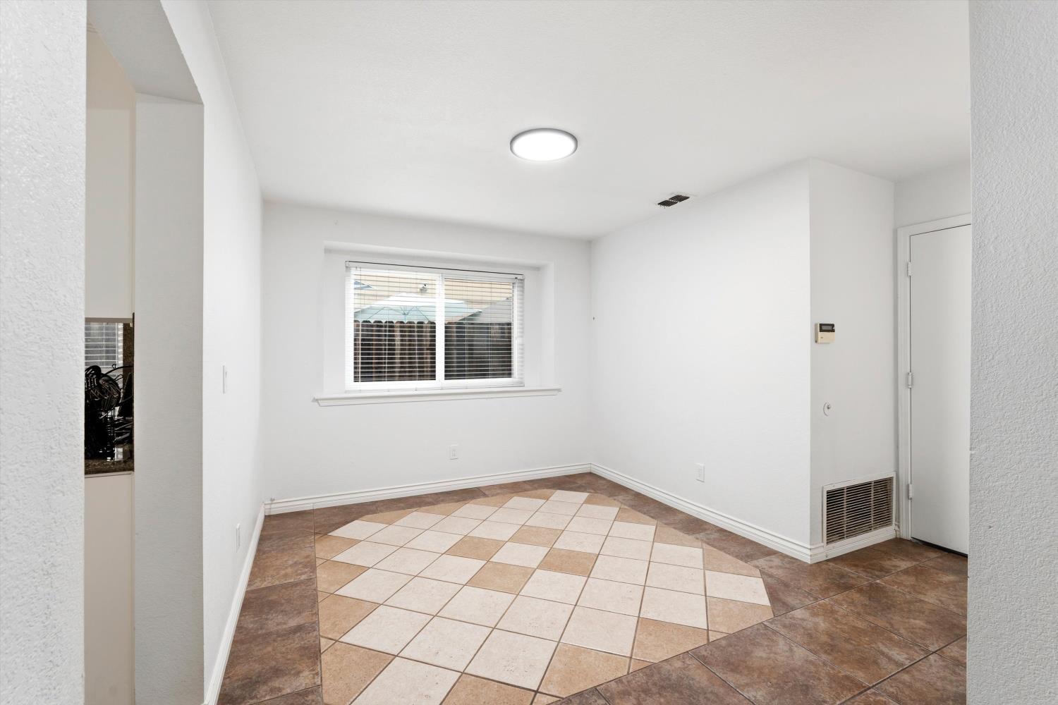 8117 Prior Way Antelope, CA 95843 - Photo 8 of 27 a view of an empty room with windows