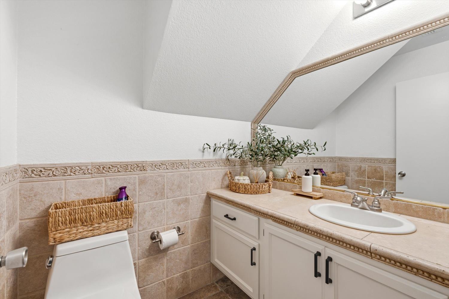 8117 Prior Way Antelope, CA 95843 - Photo 10 of 27 a bathroom with a sink and a mirror