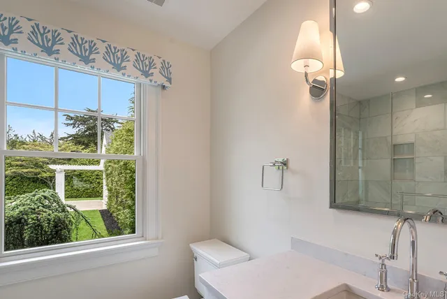 a bathroom with a toilet and a sink