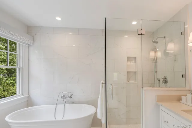 a bathroom with a bathtub and a sink