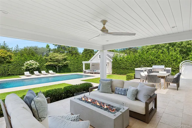 a view of a patio with couches table and chairs