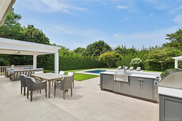 a view of a patio with a table and chairs