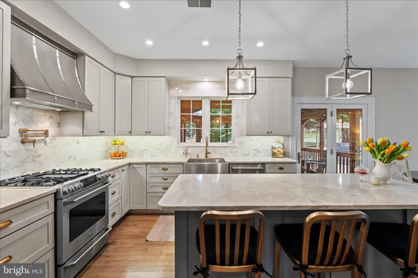 a kitchen with a stove and cabinets
