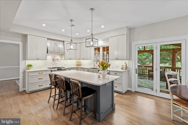 a kitchen with appliances cabinets and a sink