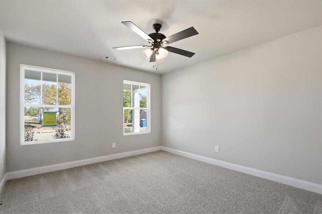 184 Rachel Lane Hartwell, GA 30643 - Photo 18 of 58 an empty room with window and ceiling fan