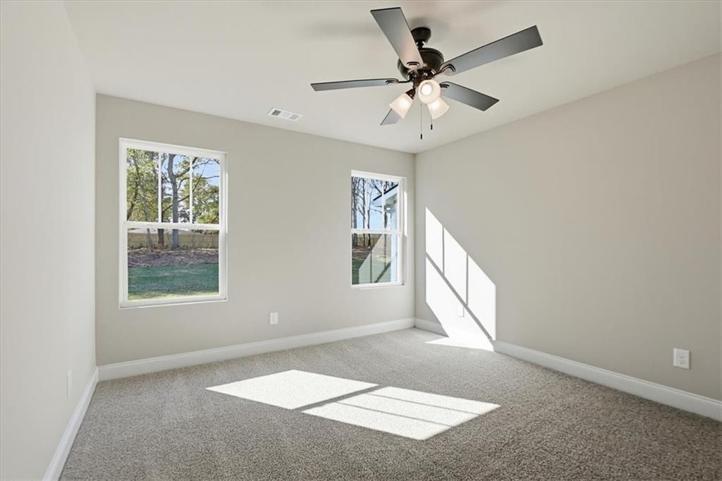 184 Rachel Lane Hartwell, GA 30643 - Photo 23 of 58 an empty room with windows and fan