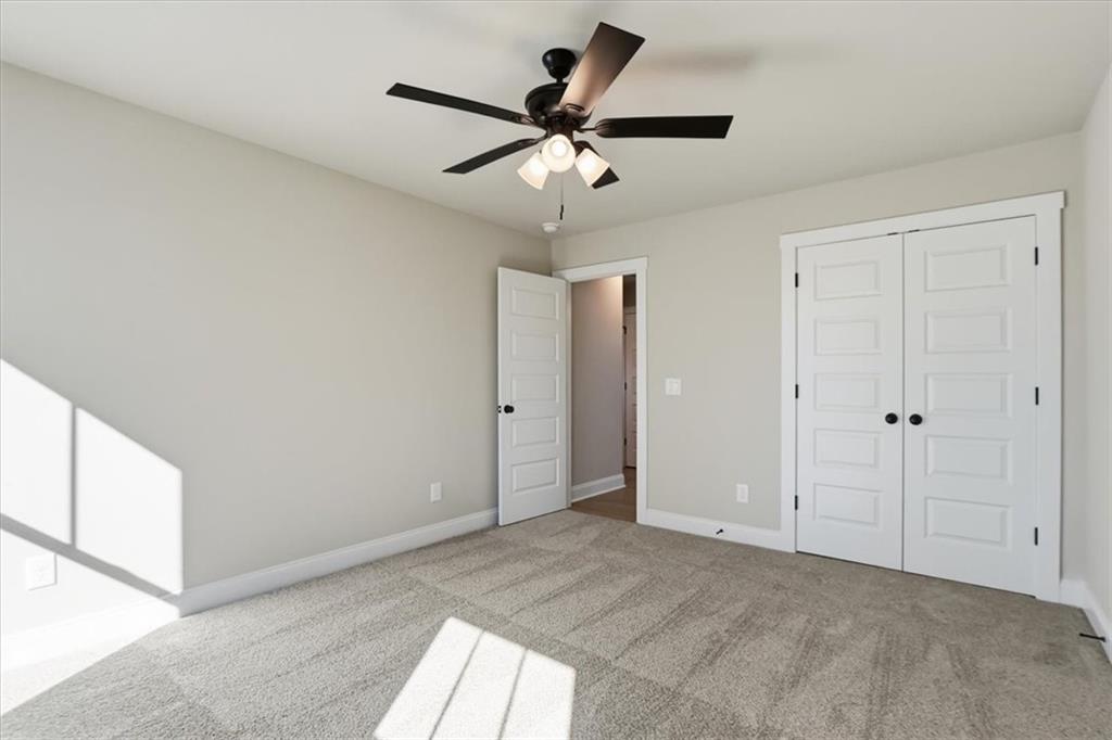 184 Rachel Lane Hartwell, GA 30643 - Photo 24 of 58 a view of an empty room and cabinet with a ceiling fan
