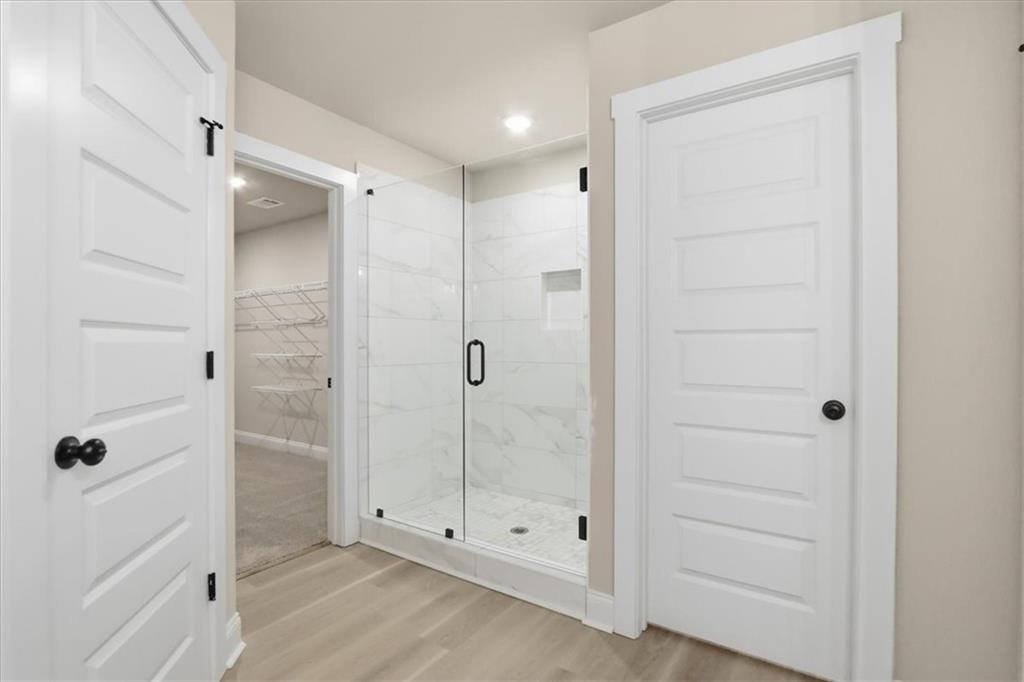 184 Rachel Lane Hartwell, GA 30643 - Photo 33 of 58 a bathroom with a glass shower door