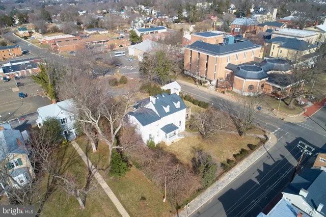 a view of a backyard with sitting area