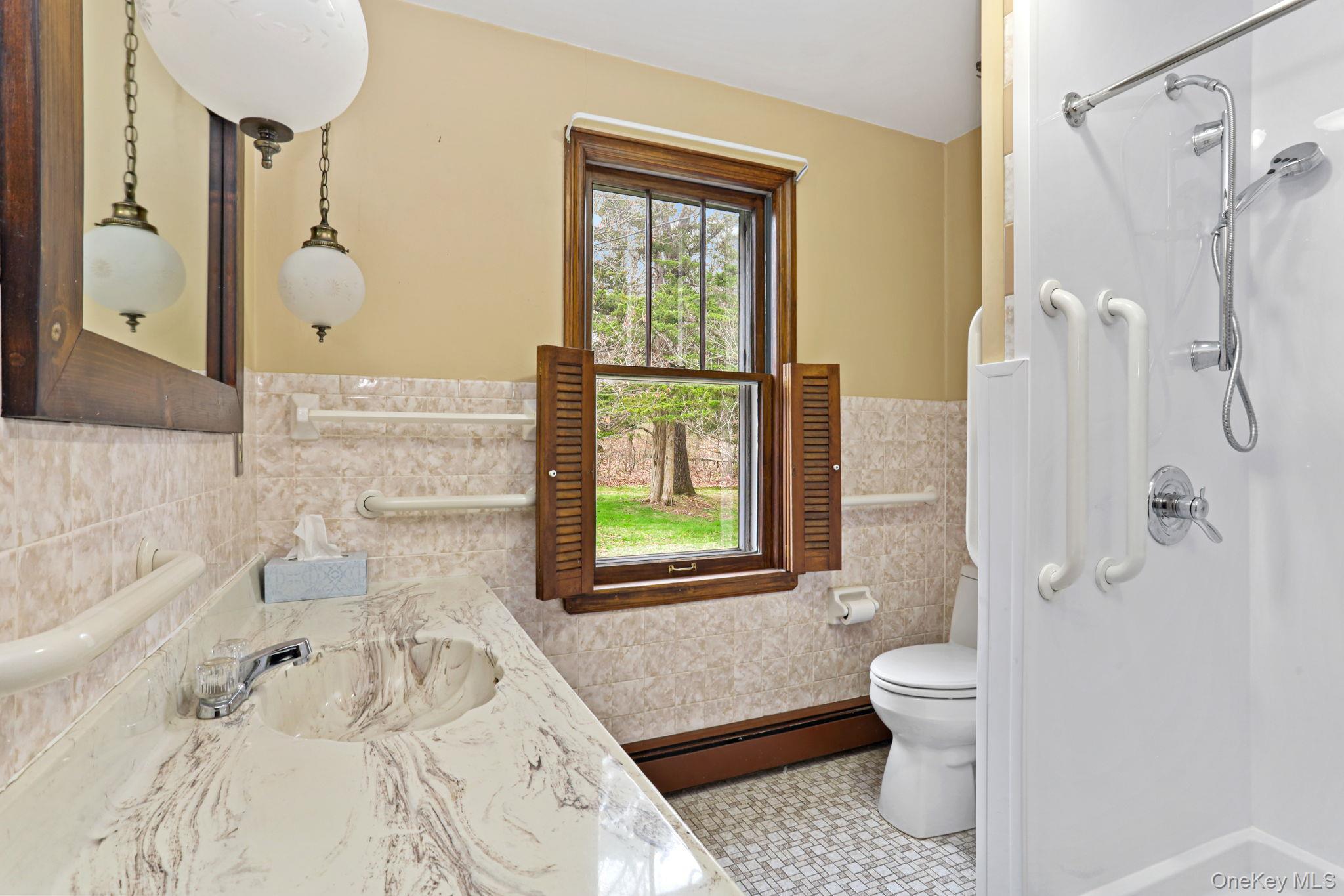 770 Gahbauer Road Hudson, NY 12534 - Photo 15 of 39 a bathroom with a toilet sink and shower