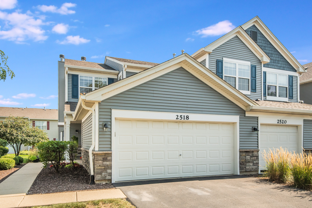 2518 Golf Ridge Circle, Unit 2518 Naperville, IL 60563 - Photo 1 of 25 a front view of a house with a garage