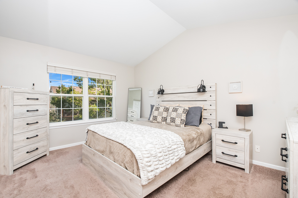 2518 Golf Ridge Circle, Unit 2518 Naperville, IL 60563 - Photo 12 of 25 a bedroom with a bed and a window