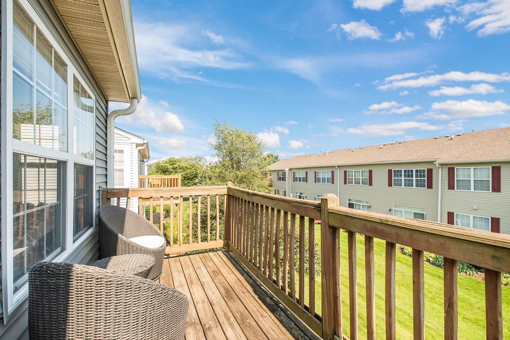 2518 Golf Ridge Circle, Unit 2518 Naperville, IL 60563 - Photo 15 of 25 a view of a balcony with two chairs and a table