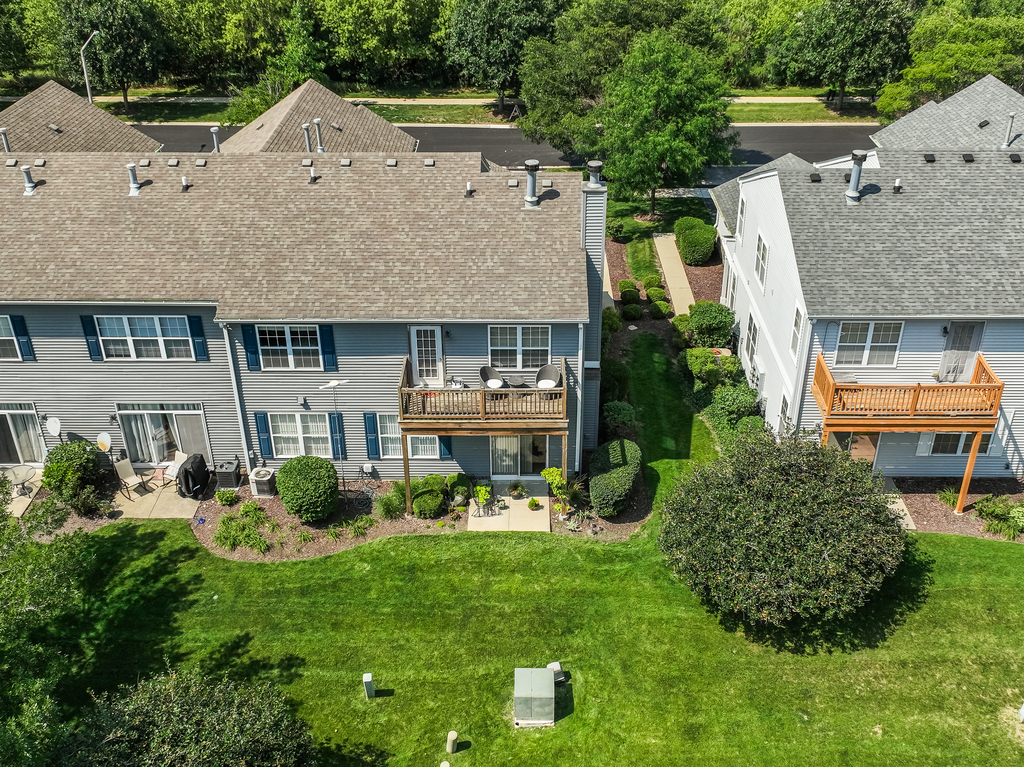 2518 Golf Ridge Circle, Unit 2518 Naperville, IL 60563 - Photo 16 of 25 an aerial view of a house with a yard table and chairs