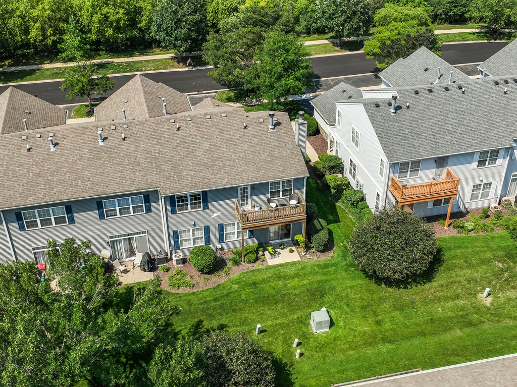 2518 Golf Ridge Circle, Unit 2518 Naperville, IL 60563 - Photo 19 of 25 an aerial view of a house with garden space and a patio