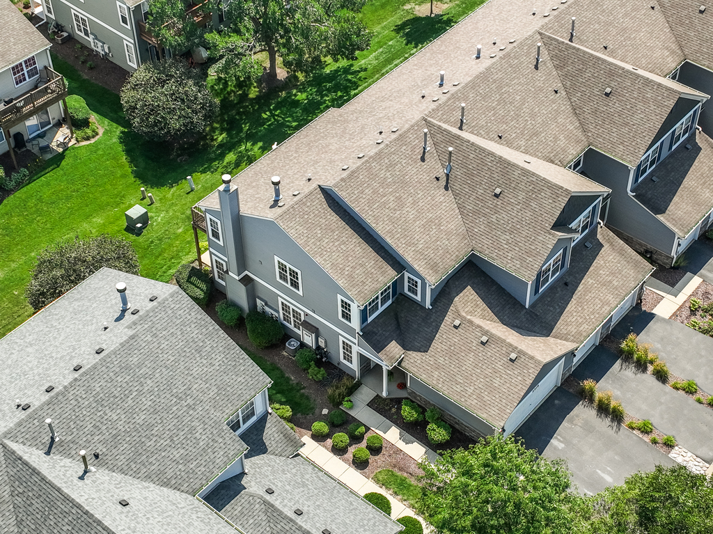 2518 Golf Ridge Circle, Unit 2518 Naperville, IL 60563 - Photo 20 of 25 an aerial view of a house with a yard