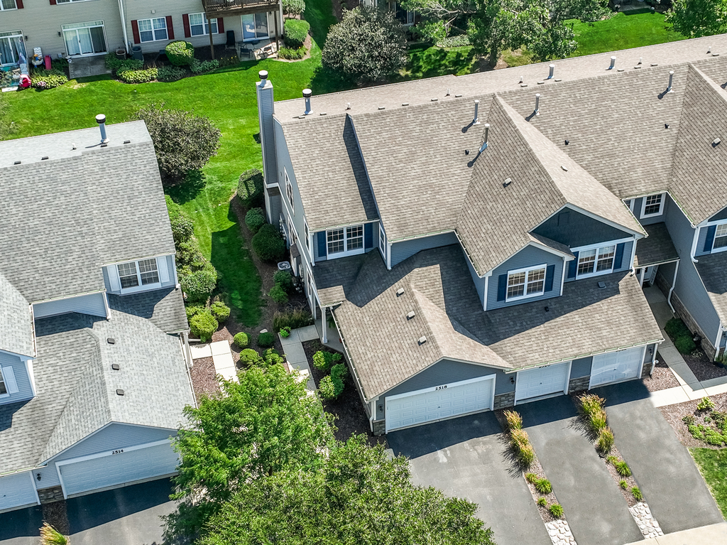2518 Golf Ridge Circle, Unit 2518 Naperville, IL 60563 - Photo 21 of 25 an aerial view of a house with garden space and street view