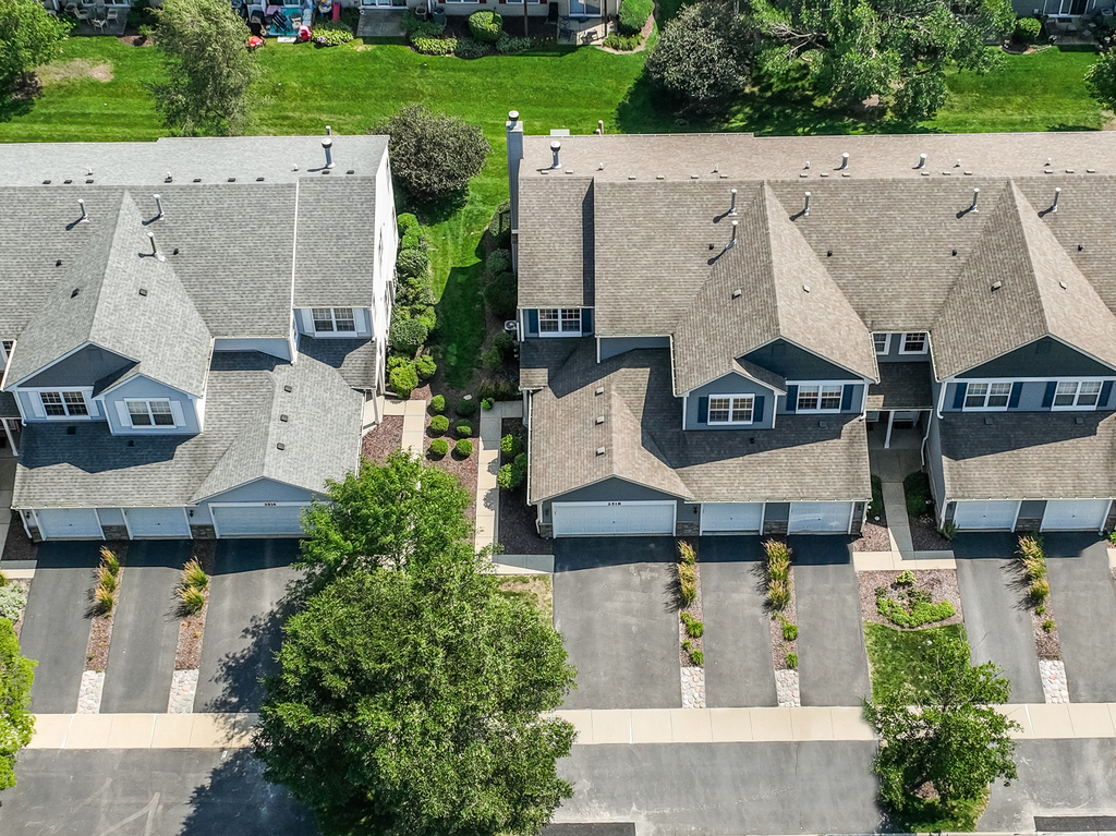 2518 Golf Ridge Circle, Unit 2518 Naperville, IL 60563 - Photo 22 of 25 an aerial view of a house with garden space and street view