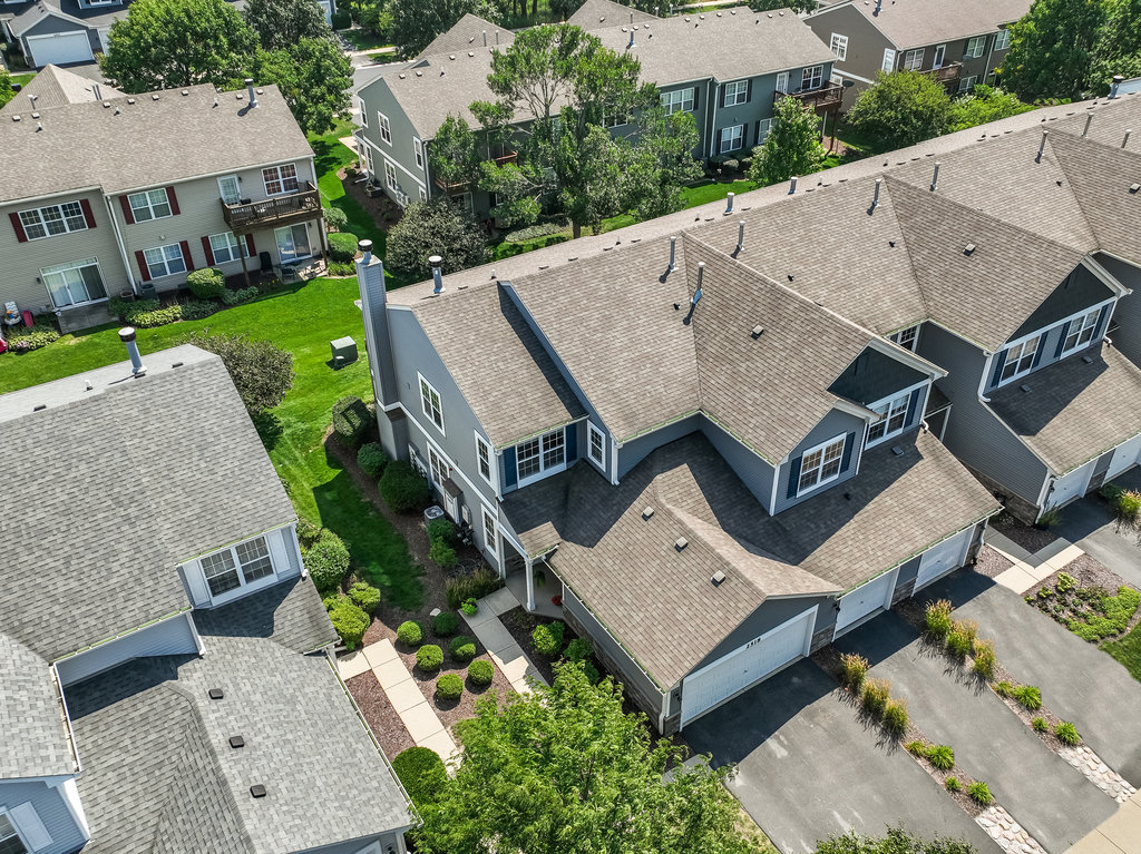 2518 Golf Ridge Circle, Unit 2518 Naperville, IL 60563 - Photo 23 of 25 an aerial view of a house with a garden