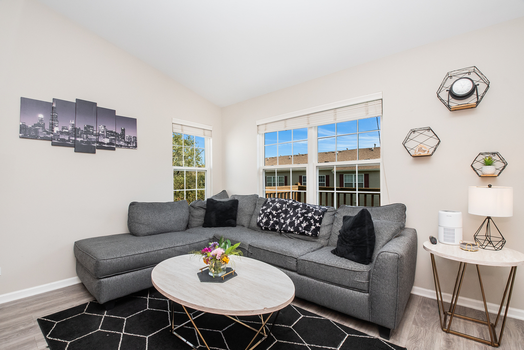 2518 Golf Ridge Circle, Unit 2518 Naperville, IL 60563 - Photo 9 of 25 a living room with furniture and a table