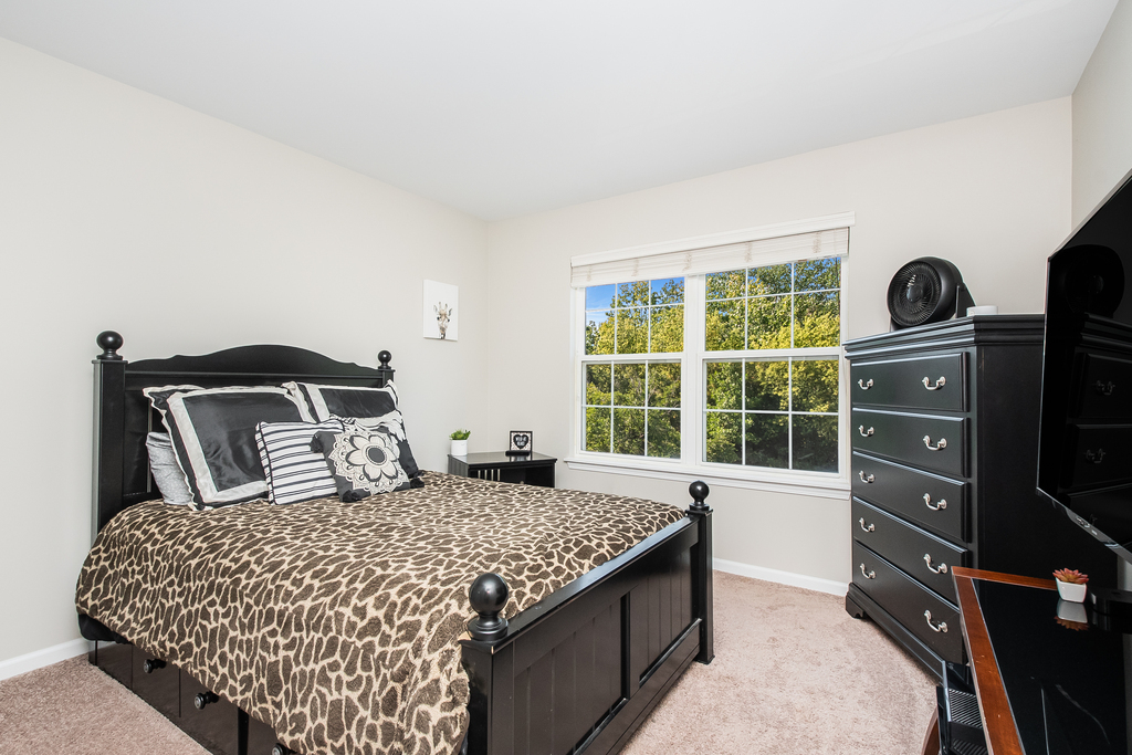 2518 Golf Ridge Circle, Unit 2518 Naperville, IL 60563 - Photo 10 of 25 a bedroom with a bed and dresser