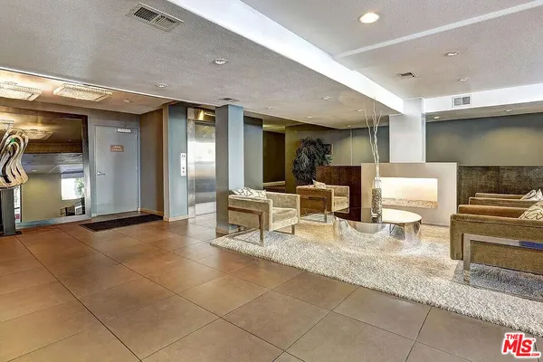a view of kitchen with furniture and counter space
