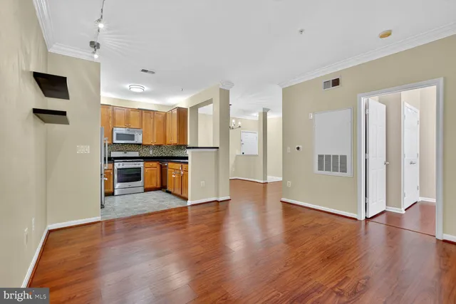 a view of an entryway with wooden floor