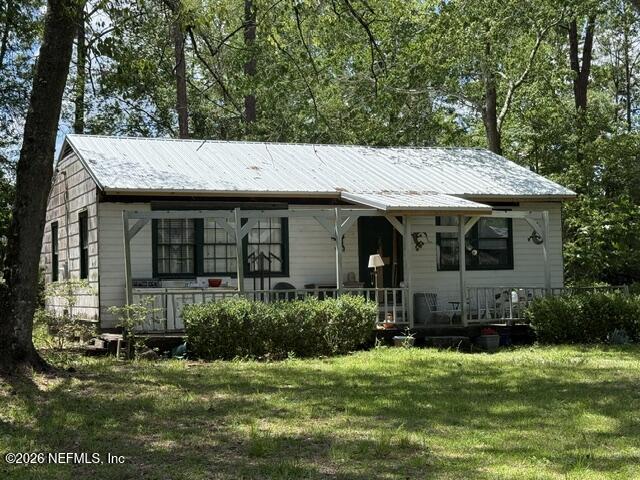 5214 Carter Spencer Road Middleburg, FL 32068 - Photo 1 of 50 a front view of a house with a garden