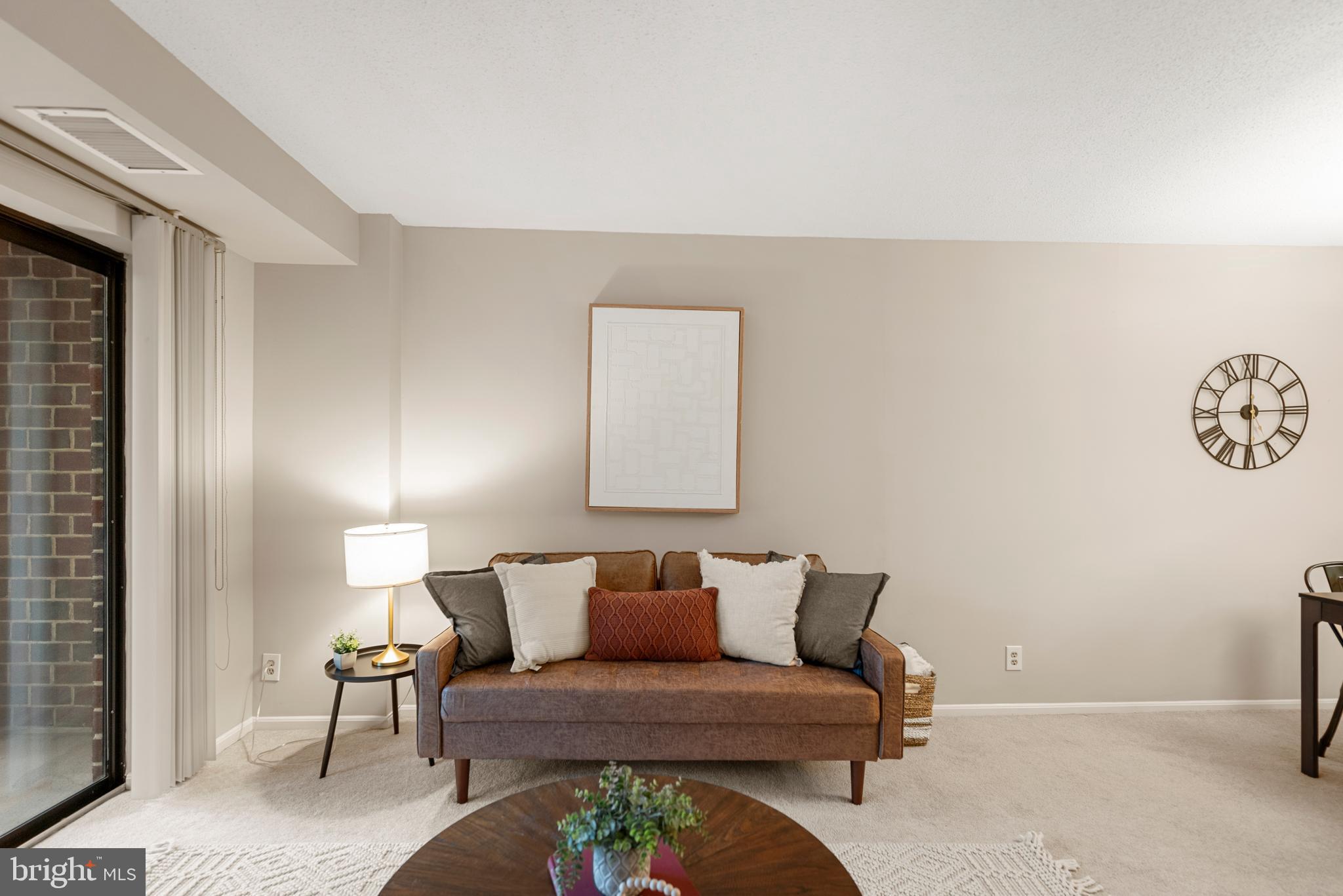 2100 Langston Boulevard, Unit 112 Arlington, VA 22201 - Photo 5 of 33 Light-Filled Living Room