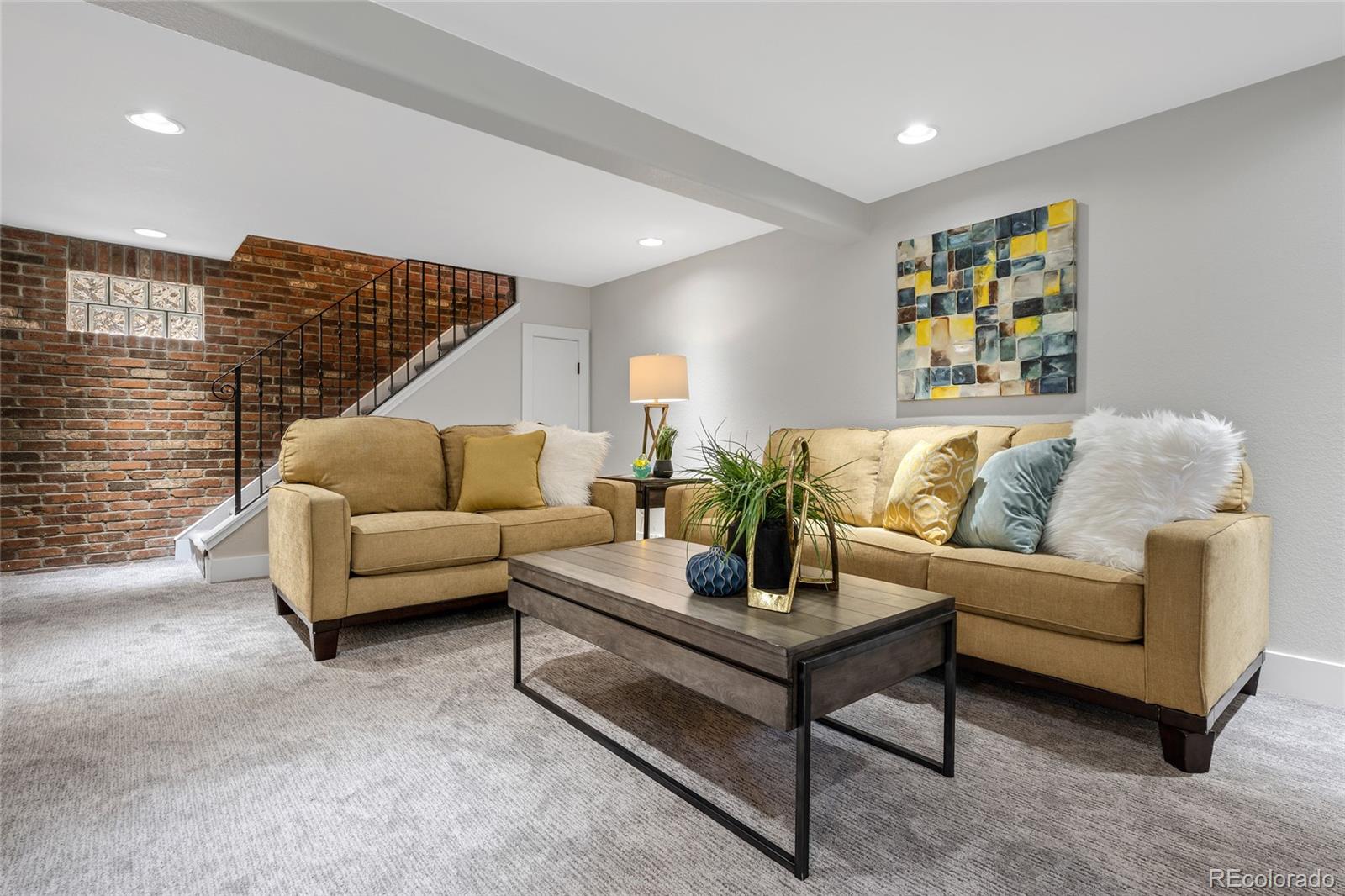 2829 Ash Street Denver, CO 80207 - Photo 26 of 40 a living room with furniture and a wooden floor