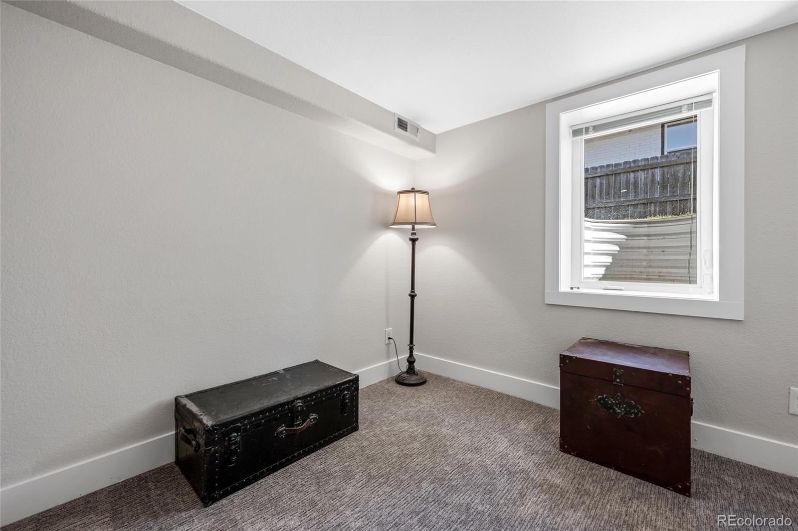 2829 Ash Street Denver, CO 80207 - Photo 34 of 40 a room with a bed and a window