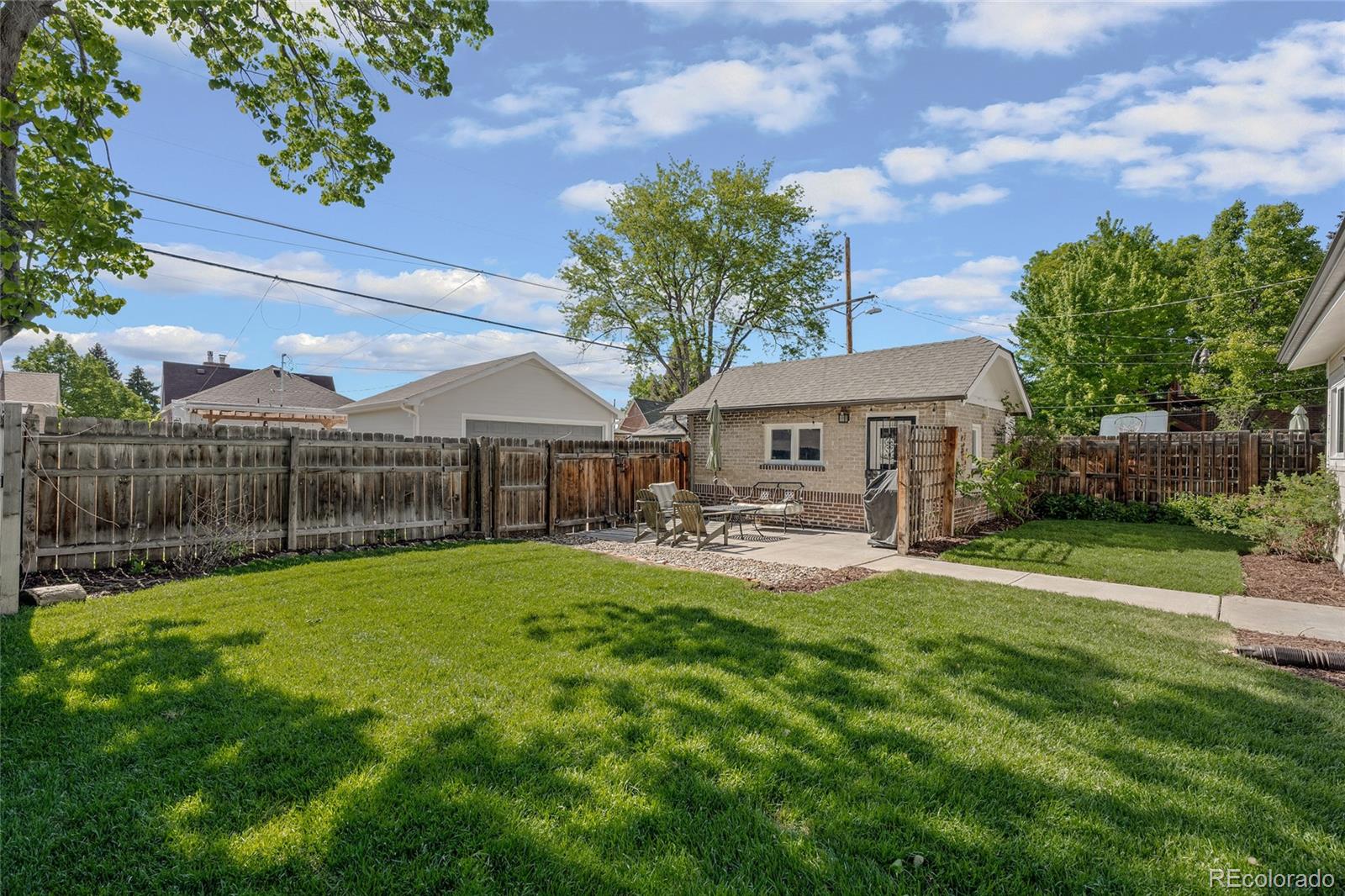 2829 Ash Street Denver, CO 80207 - Photo 38 of 40 a view of a house with backyard and sitting area