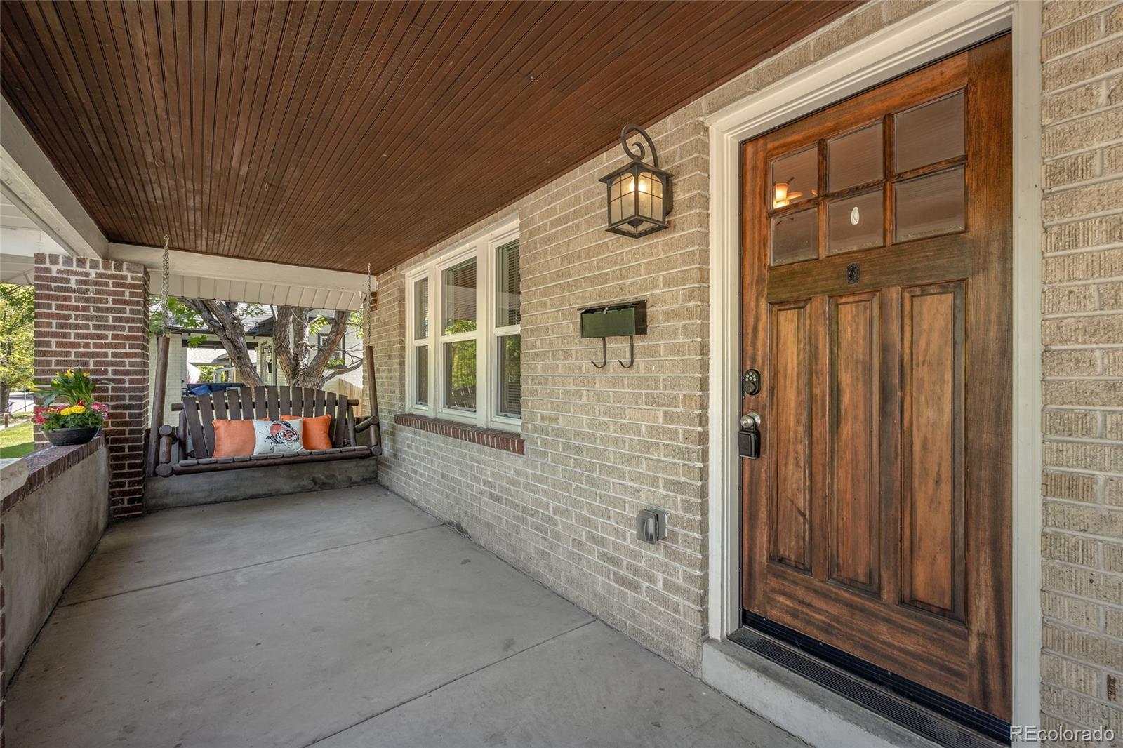 2829 Ash Street Denver, CO 80207 - Photo 4 of 40 a view of front door and porch