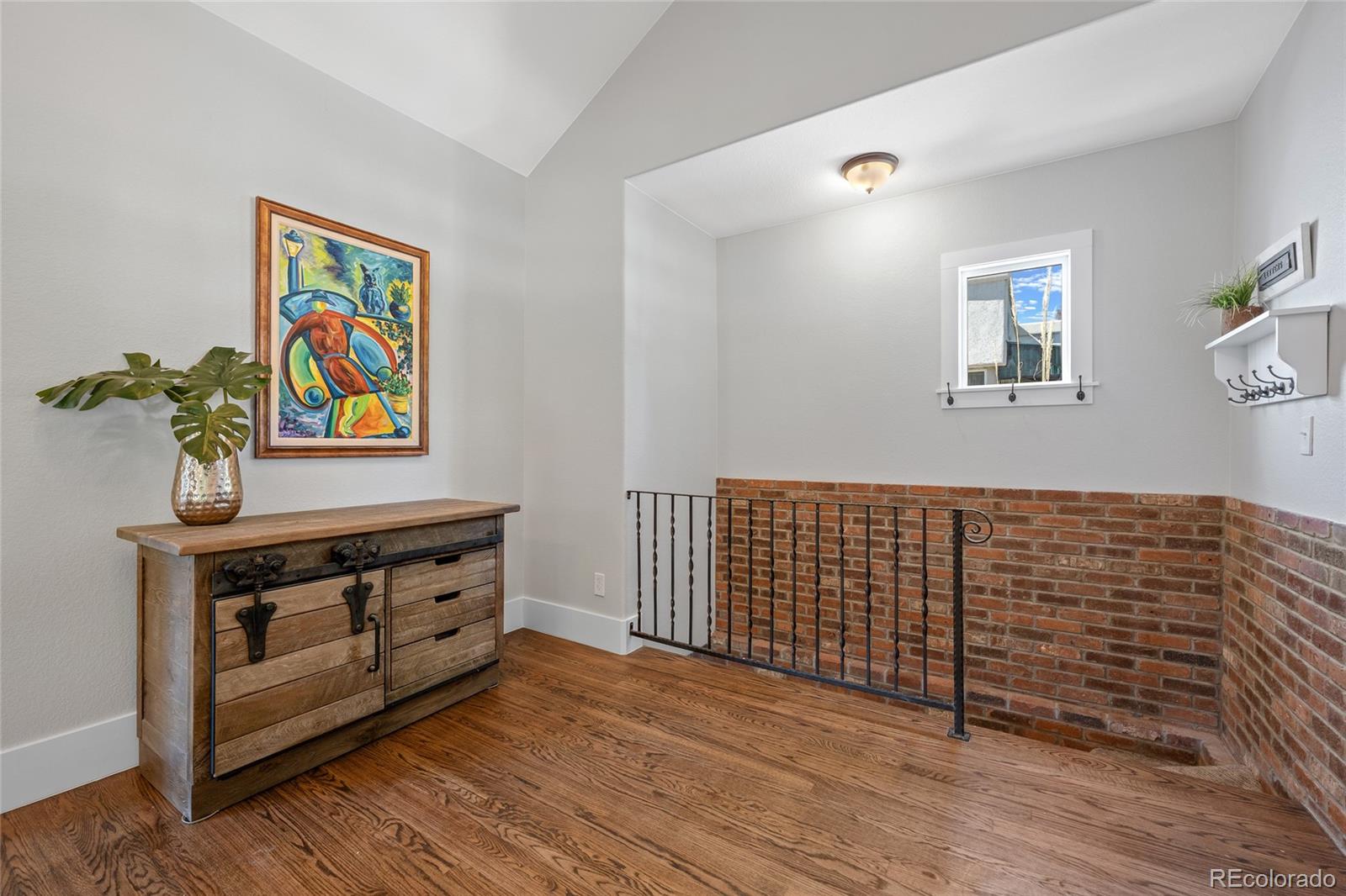 2829 Ash Street Denver, CO 80207 - Photo 5 of 40 a view of livingroom with furniture and wooden floor