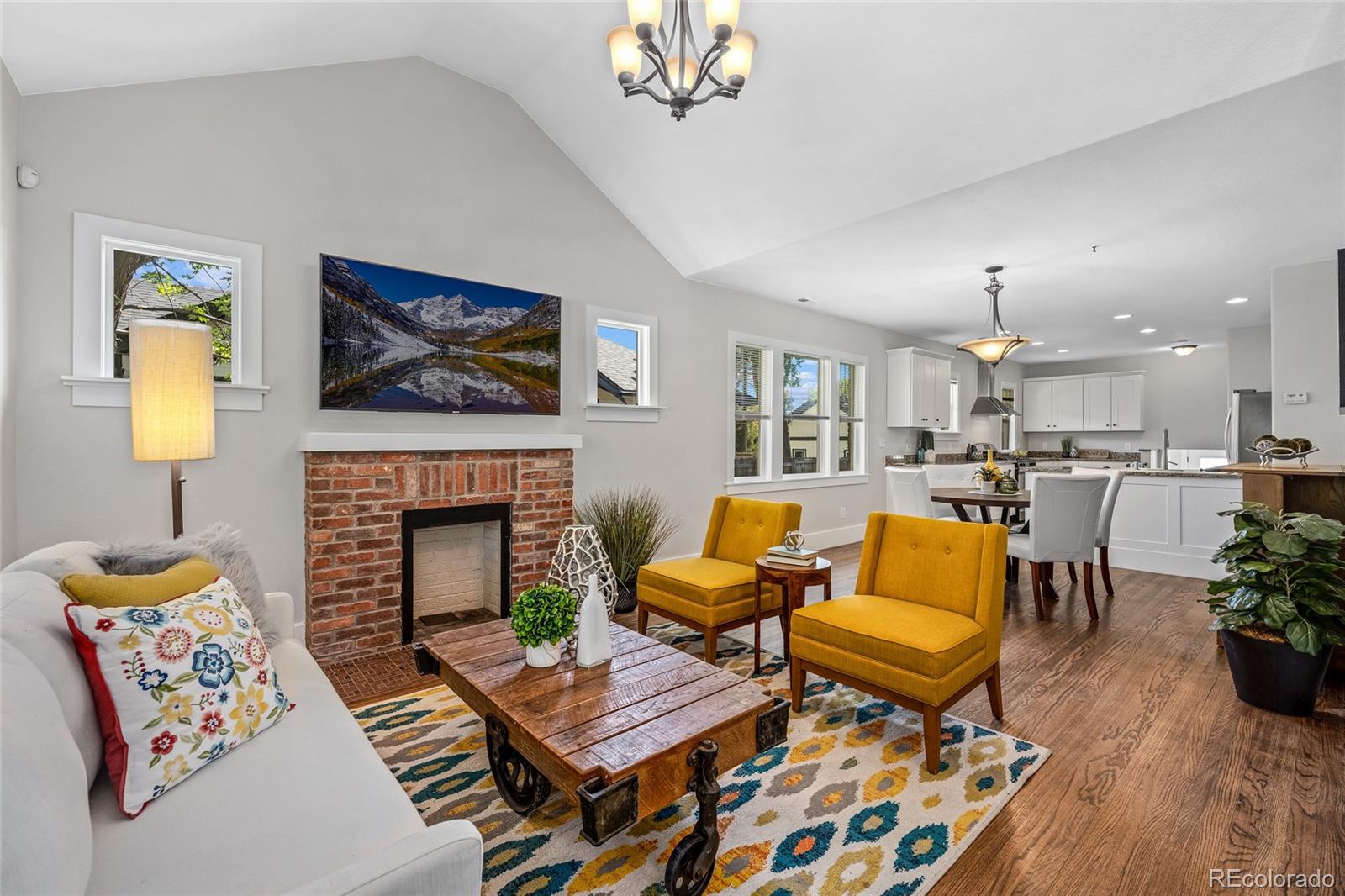 2829 Ash Street Denver, CO 80207 - Photo 7 of 40 a living room with furniture fireplace and wooden floor