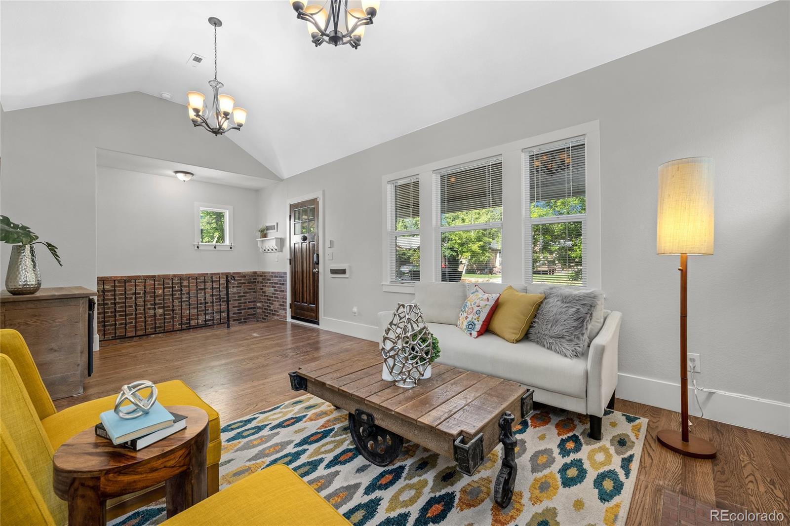 2829 Ash Street Denver, CO 80207 - Photo 10 of 40 a living room with furniture and wooden floor