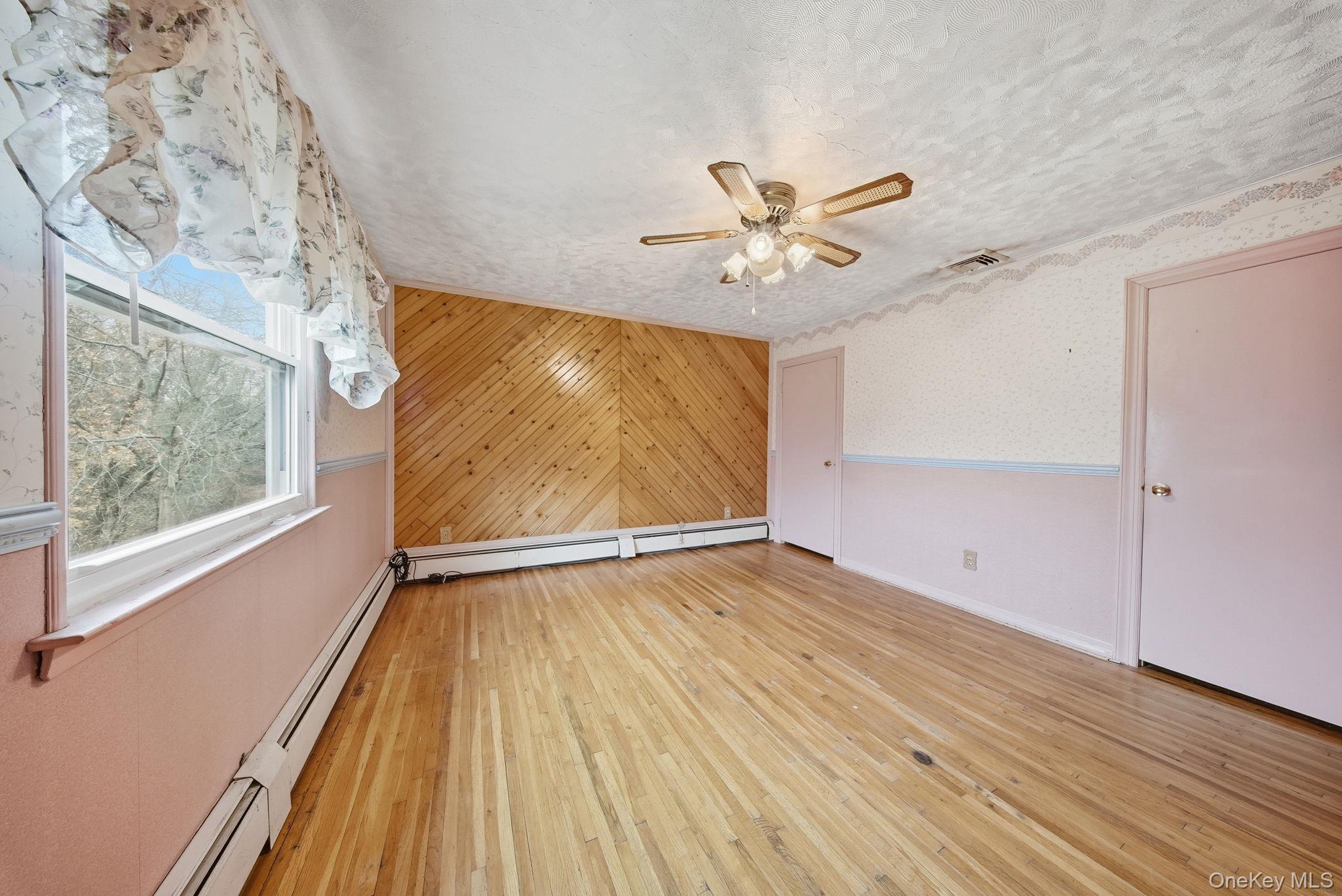 16 Mountain Avenue Middletown, NY 10940 - Photo 17 of 35 wooden floor in an empty room with a window