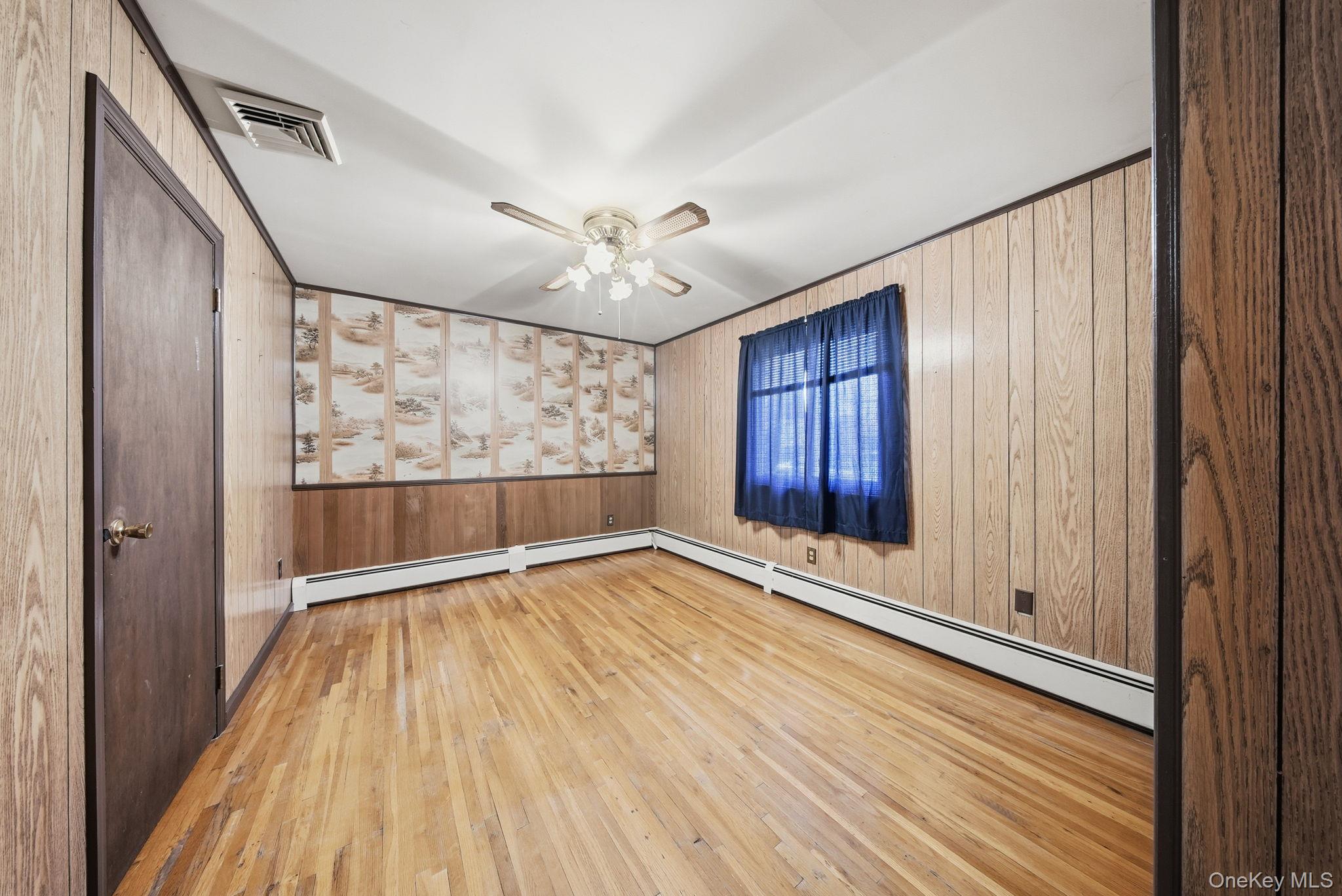 16 Mountain Avenue Middletown, NY 10940 - Photo 20 of 35 a view of an empty room with wooden floor and a window