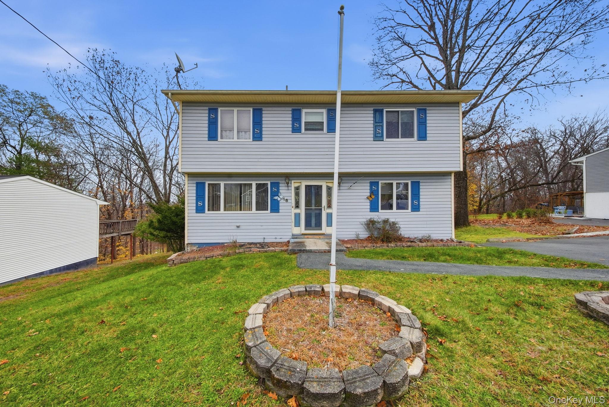 16 Mountain Avenue Middletown, NY 10940 - Photo 2 of 35 a front view of a house with a yard