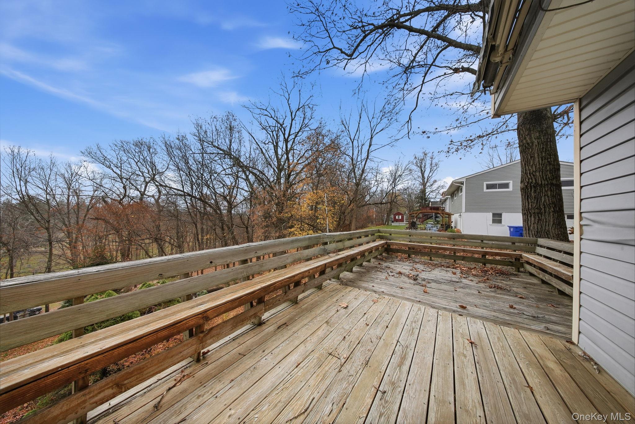16 Mountain Avenue Middletown, NY 10940 - Photo 31 of 35 a view of a yard with wooden deck and trees