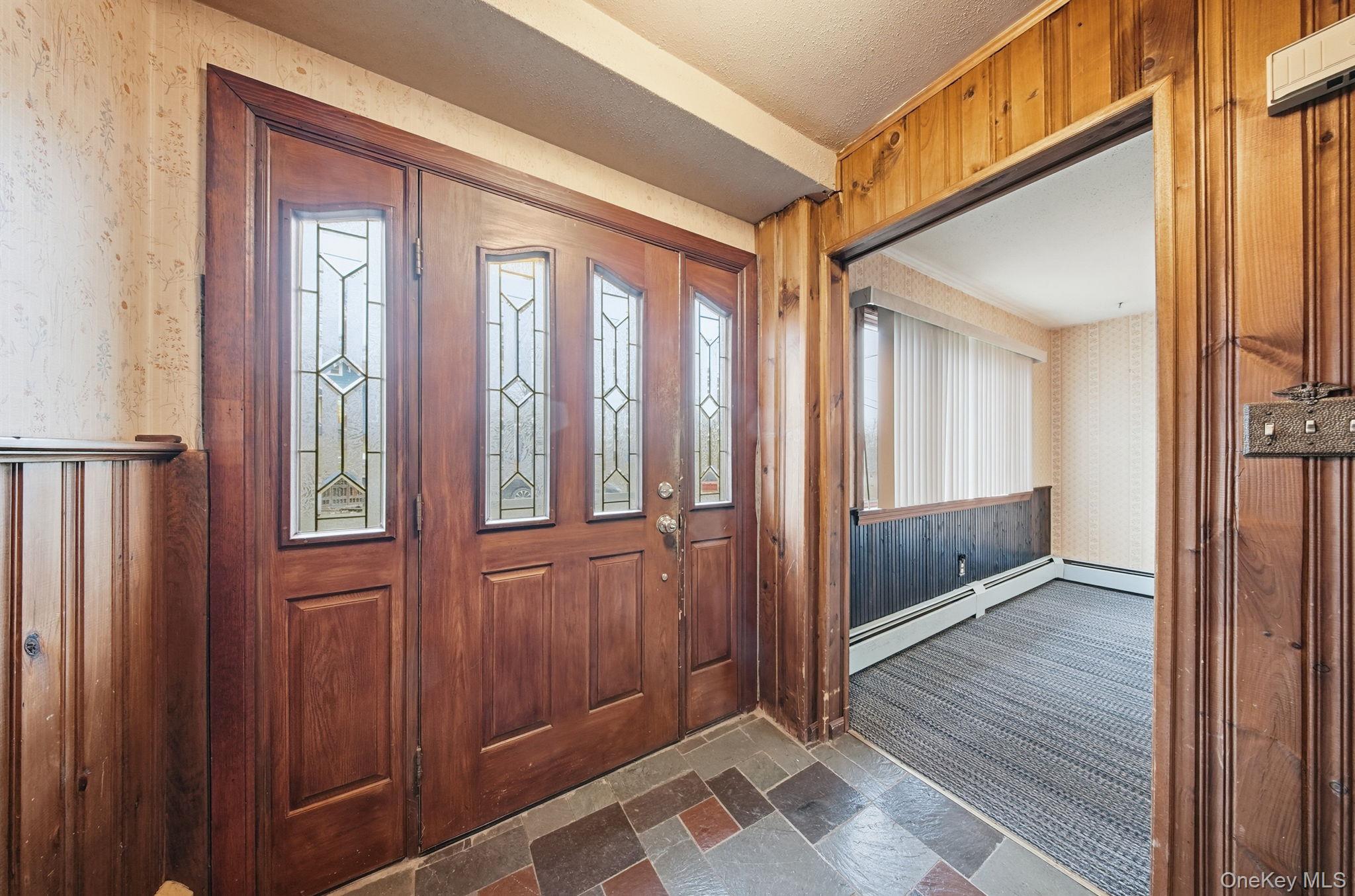 16 Mountain Avenue Middletown, NY 10940 - Photo 9 of 35 a view of a hallway with wooden floor and staircase