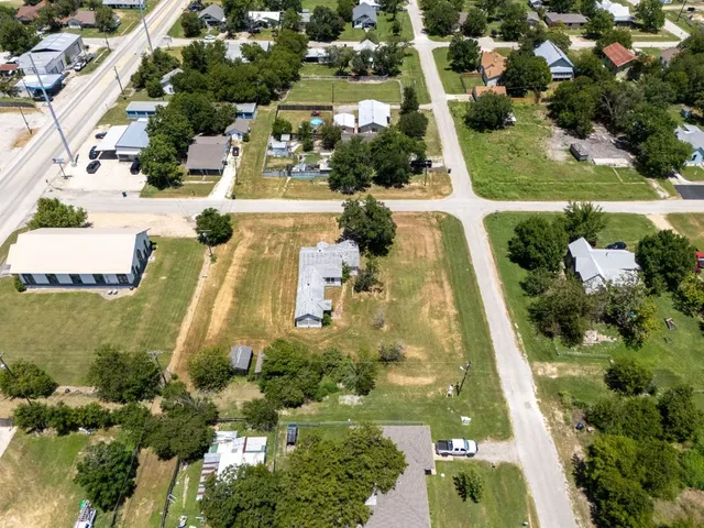 an aerial view of residential houses with outdoor space