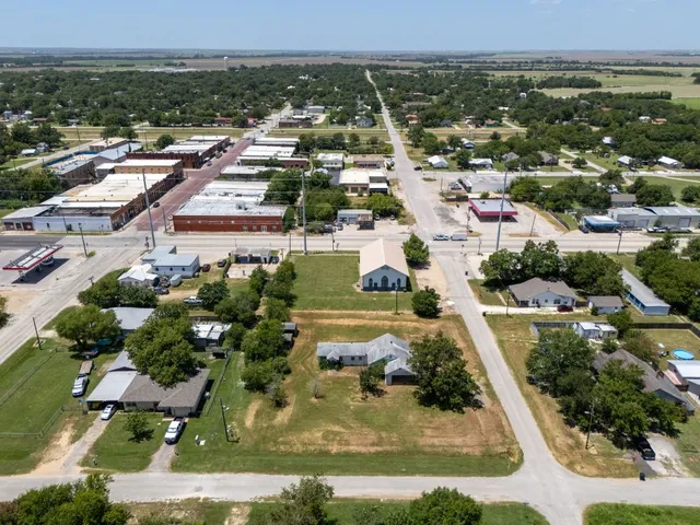 an aerial view of residential houses with outdoor space