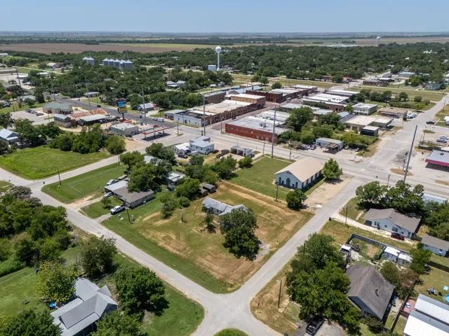an aerial view of residential houses with outdoor space