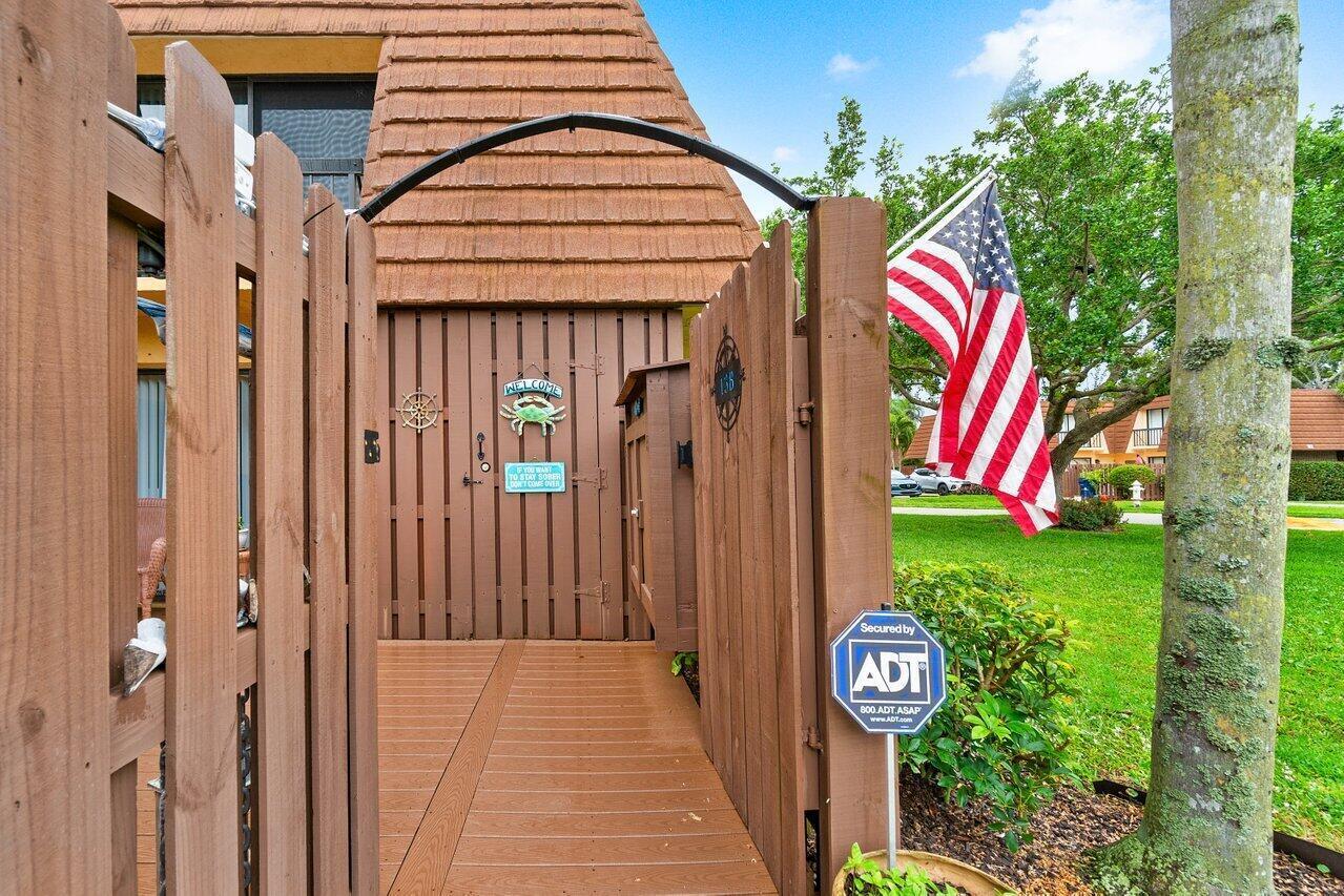 825 Center Street, Unit 13B Jupiter, FL 33458 - Photo 3 of 39 a view of a entryway door of the house