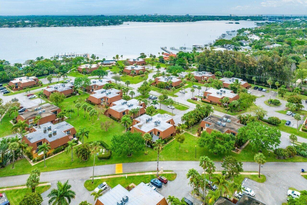 825 Center Street, Unit 13B Jupiter, FL 33458 - Photo 34 of 39 an aerial view of a houses with a lake view