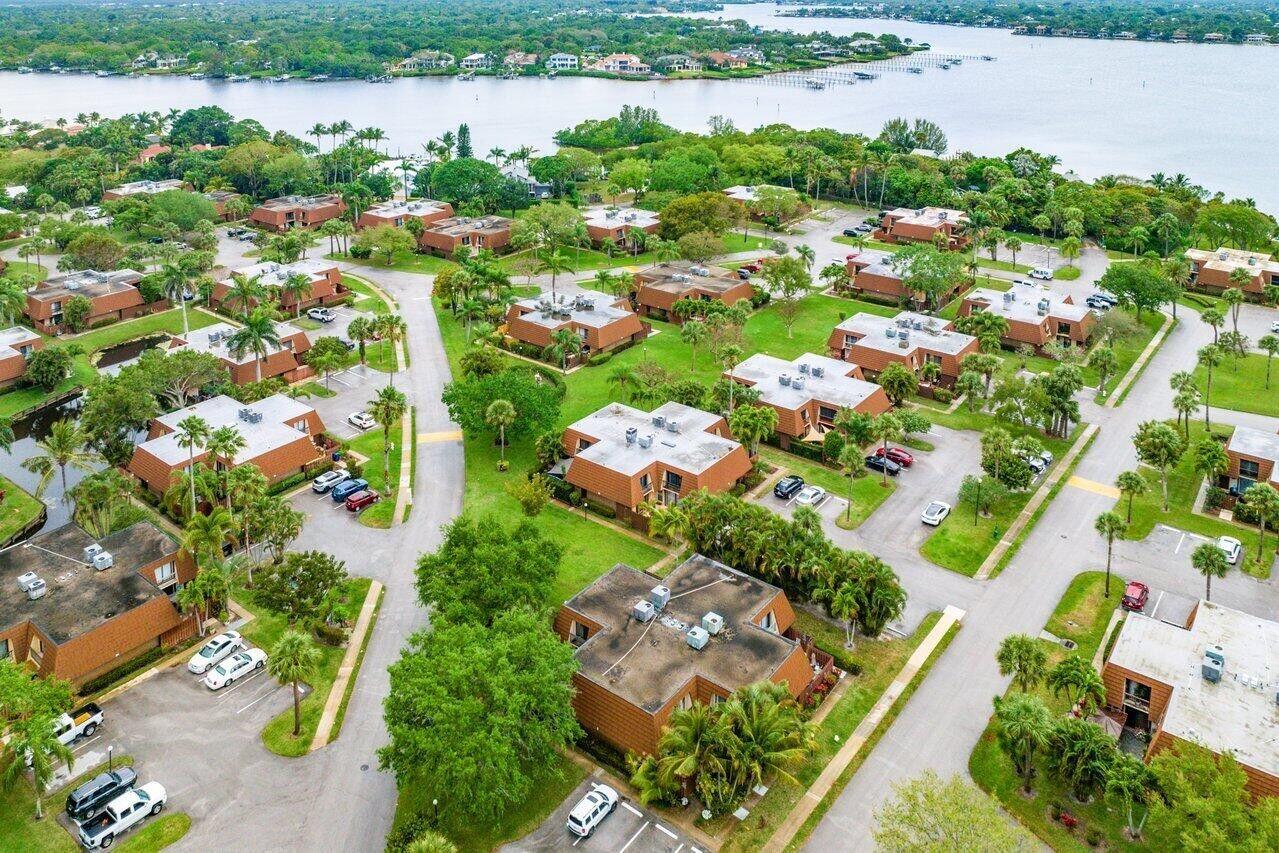 825 Center Street, Unit 13B Jupiter, FL 33458 - Photo 37 of 39 an aerial view of lake residential houses with outdoor space and swimming pool