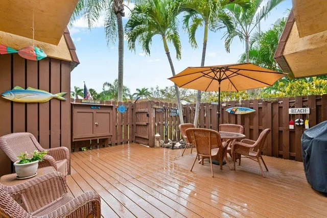 a patio with a patio table and chairs