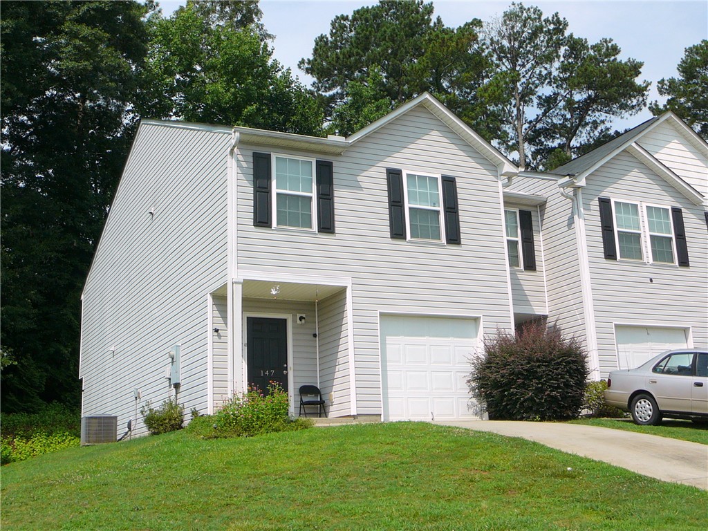 147 Evonshire Boulevard Anderson, SC 29621 - Photo 1 of 19 A welcoming facade with a garage, inviting you to a comfortable lifestyle.
