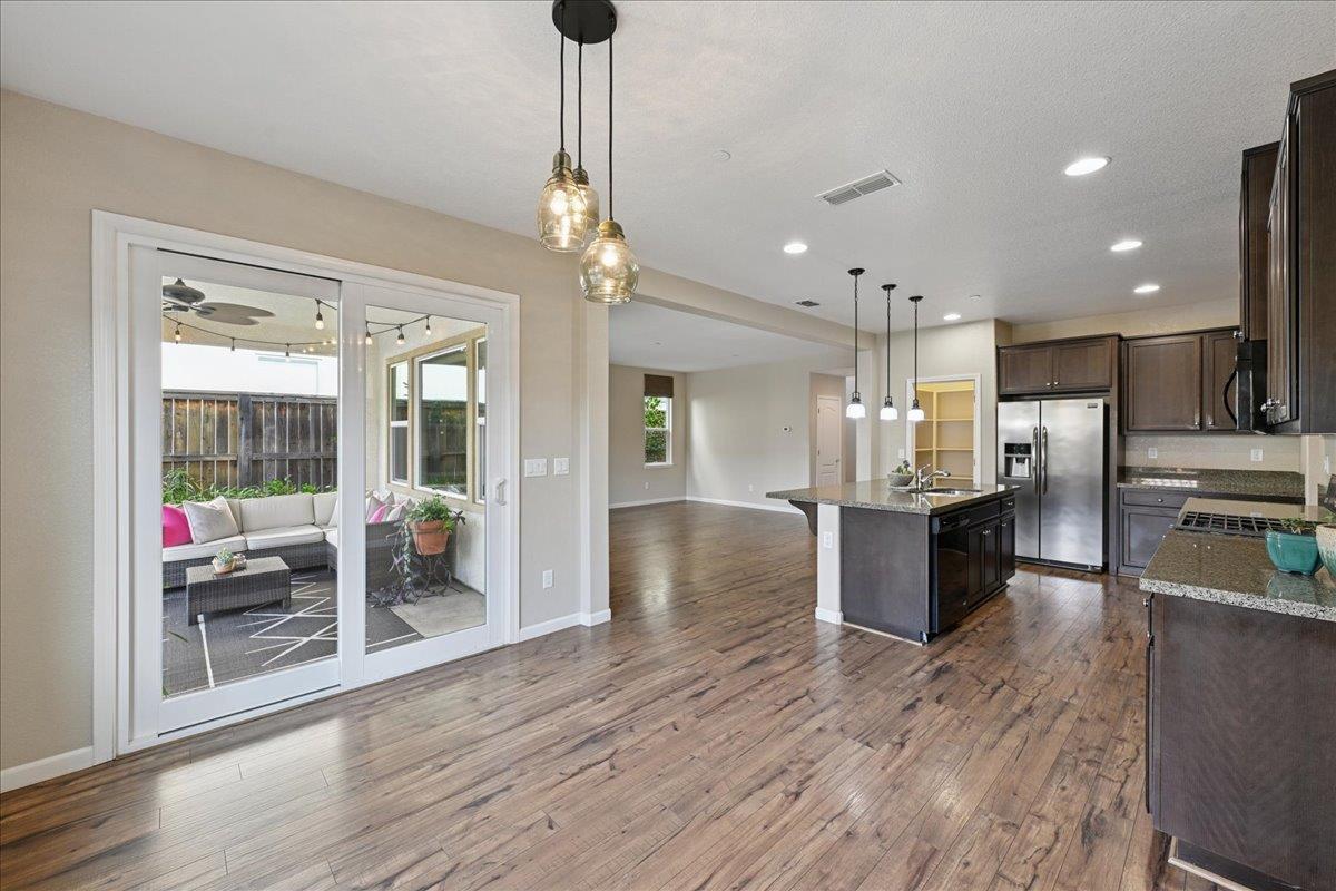 706 Wagon Trail Way Rocklin, CA 95765 - Photo 13 of 61 a view of kitchen with sink microwave and refrigerator